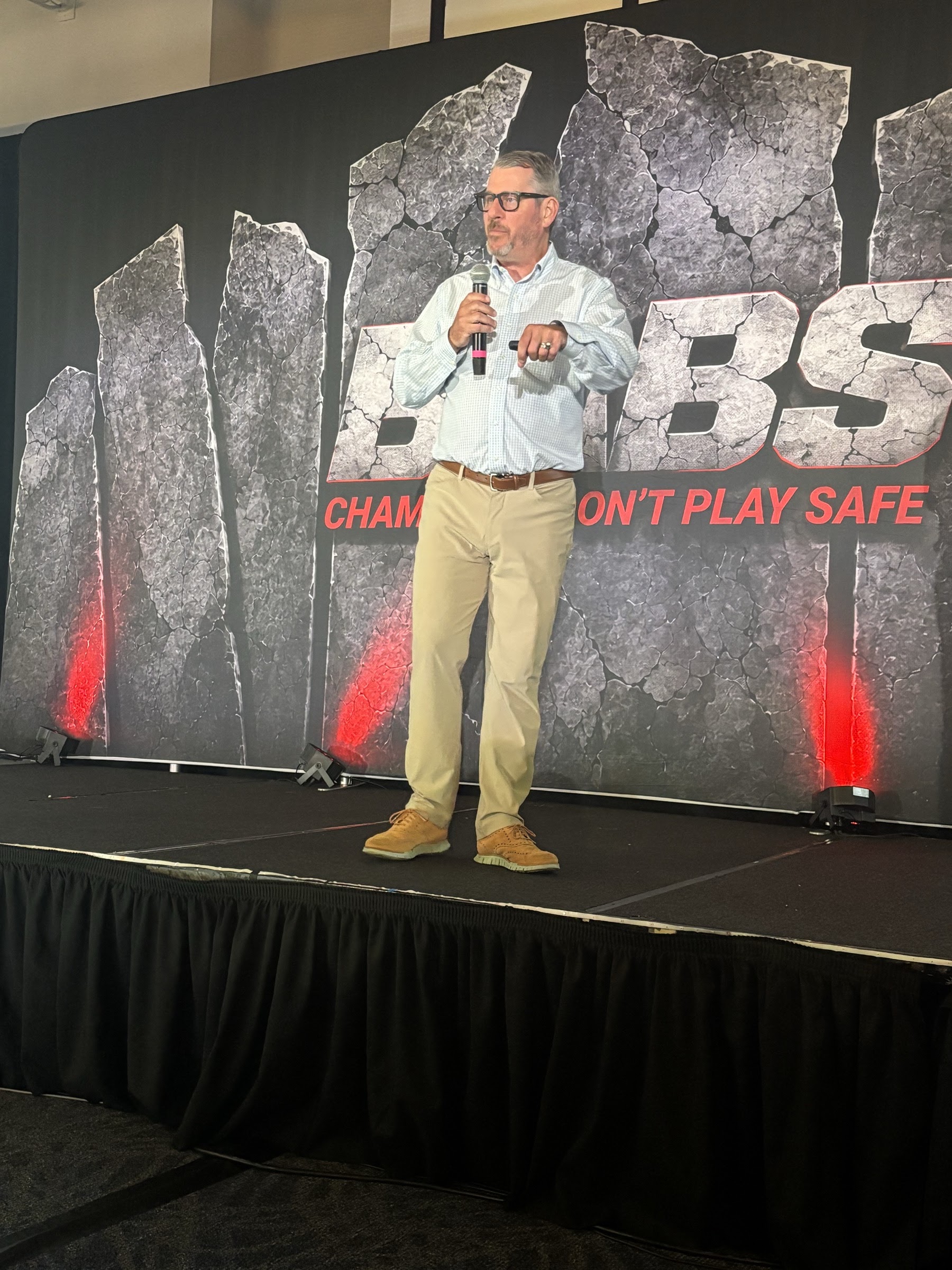 Jerry Macnamara on the main stage at the Badass Business Summit 2026 in Dallas